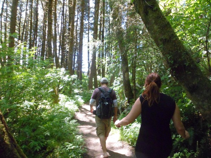 Greg (barefoot?) and Cat walking the trail
