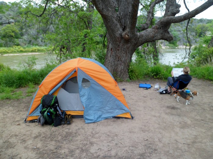 Camp with Court studying the trail map in the background